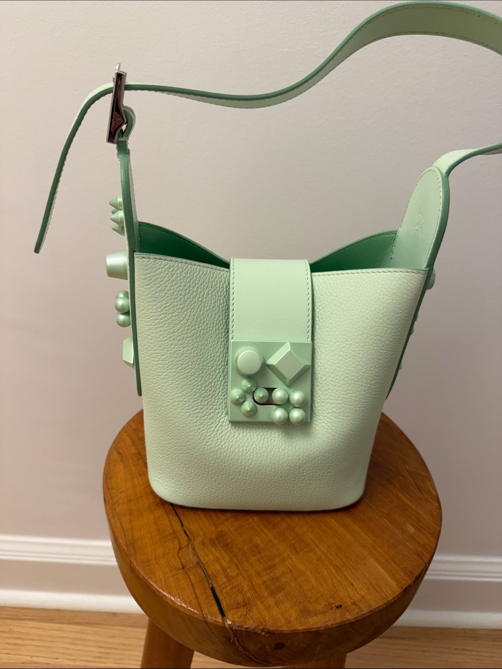 CHRISTIAN LOUBOUTIN
Green Pebbled Leather Carasky Bucket Bag